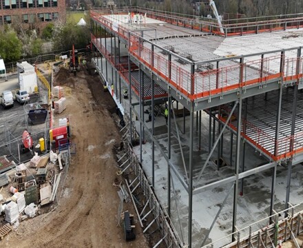 Aerial view of corner of school build with floors in place week 23