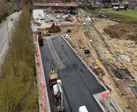 Aerial view across the Hopescourt site showing carpark and frame in distance