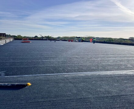 Week 28 progress people working on school roof