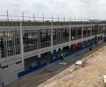 Week 31 view ofd building showing walls being completed and cladded